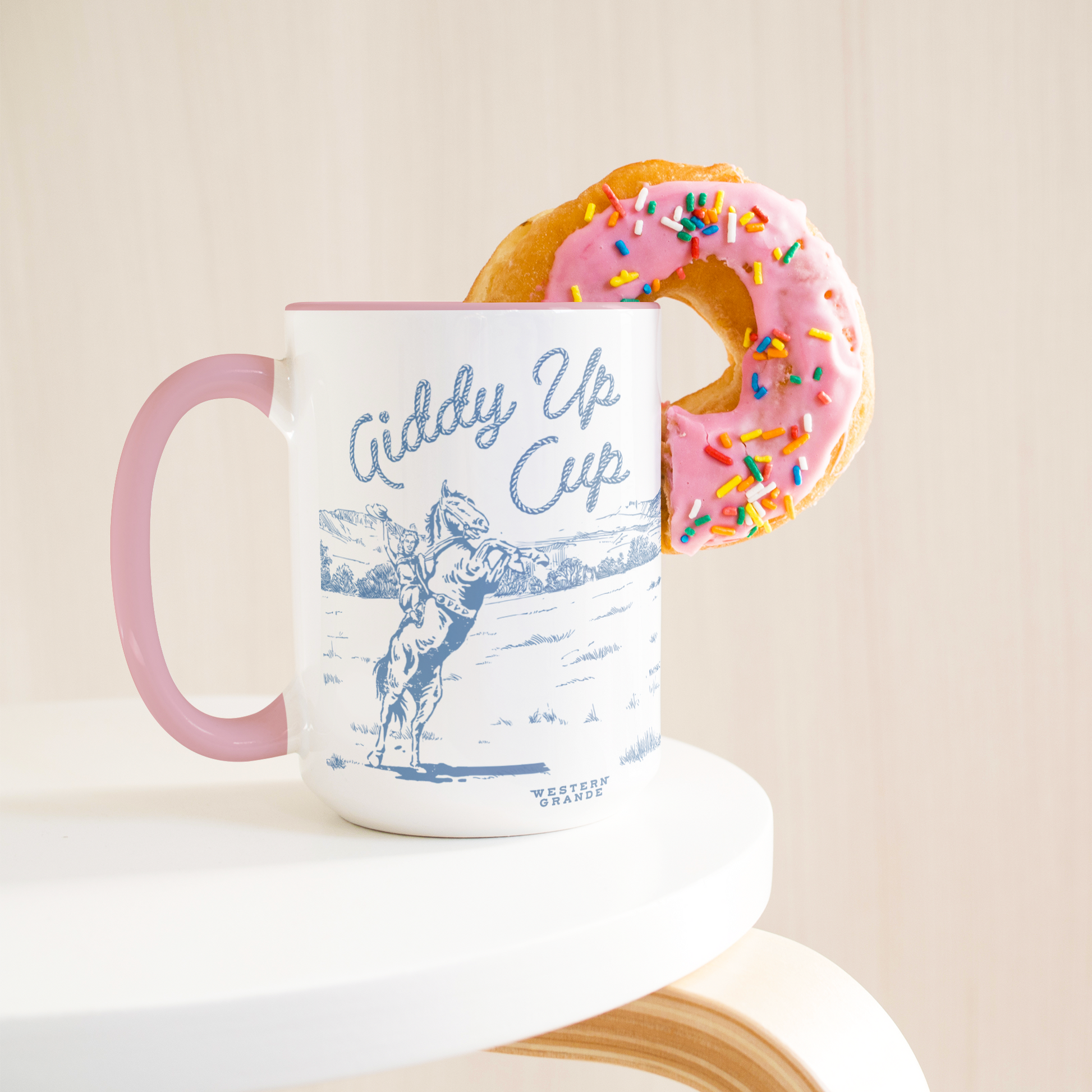 Giddy_Up_Cup_-_Blue__Purple_on_Pink_Lifestyle_Donut_LH_Mockup.png